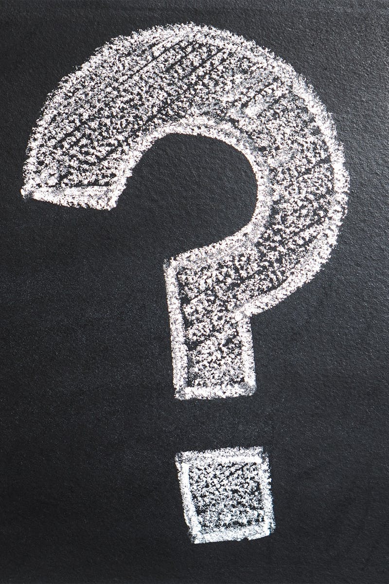 A conceptual image featuring a question mark drawn on a chalkboard, ideal for problem-solving contexts.